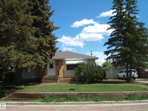 Single-story residence featuring light-colored siding and a contrasting roof - 5023 50 Street, Two Hills, AB - Outdoor