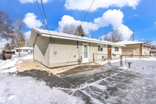 The property features a concrete paved area and a fenced yard with a gate - 11 Sonora Drive, St. Albert, AB - Outdoor