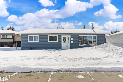 The property features a single-story design with blue siding and white trim - 11 Sonora Drive, St. Albert, AB - Outdoor