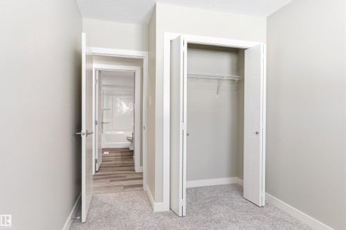 This interior space features light grey walls and light-colored carpeting - 11 Sonora Drive, St. Albert, AB - Indoor Photo Showing Other Room