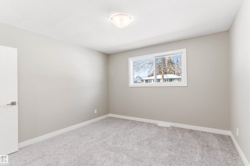 This room features light grey walls, a single window, and a ceiling-mounted light fixture - 11 Sonora Drive, St. Albert, AB - Indoor Photo Showing Other Room