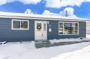 The property features a blue exterior with white trim and a white front door - 11 Sonora Drive, St. Albert, AB  - Outdoor 