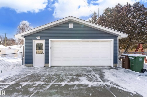 The property includes a detached garage with blue siding and white trim - 11 Sonora Drive, St. Albert, AB - Outdoor With Exterior