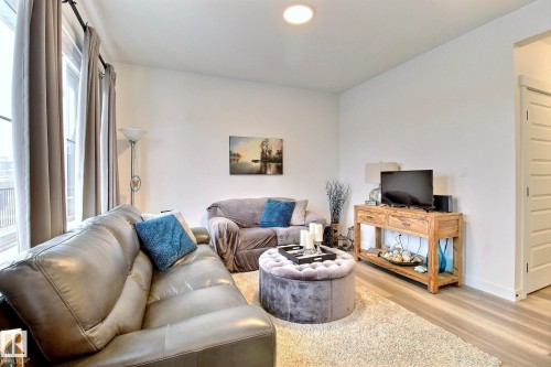 30 1910 Collip View, Edmonton, AB - Indoor Photo Showing Living Room With Fireplace