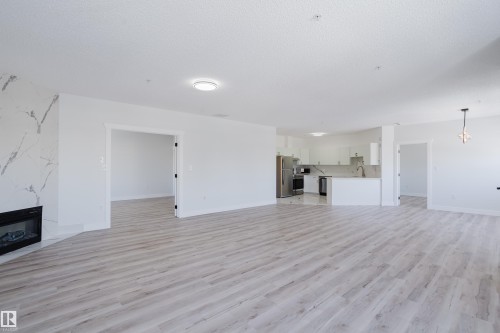 703 9919 105 Street, Edmonton, AB - Indoor With Fireplace