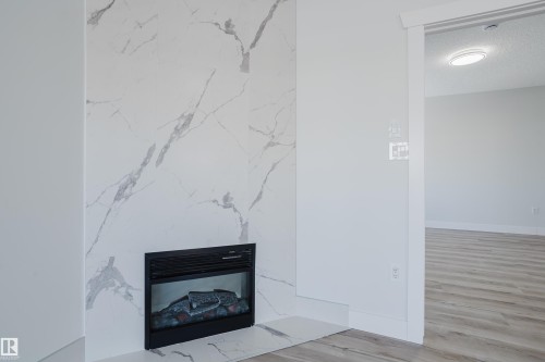 703 9919 105 Street, Edmonton, AB - Indoor With Fireplace