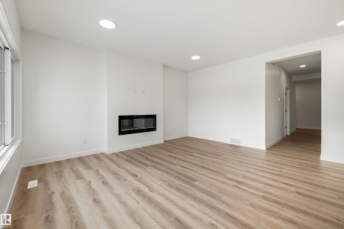 1315 11 Avenue, Edmonton, AB - Indoor Photo Showing Living Room With Fireplace