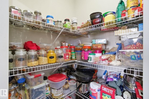 This pantry features white wire shelving providing extensive storage - 3026 16A Avenue, Edmonton, AB - Indoor With Storage