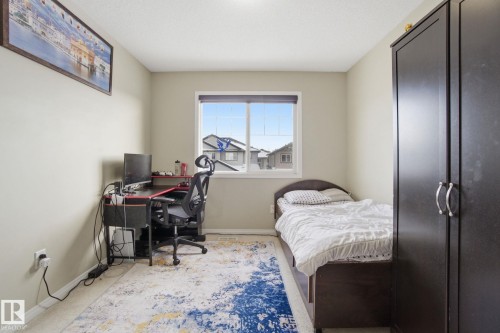 The room features light-colored walls and carpeted flooring - 3026 16A Avenue, Edmonton, AB - Indoor