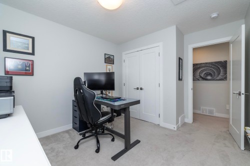 This room features light grey walls, carpeted flooring, and a flush mount ceiling light - 26 Ellice Bend, Fort Saskatchewan, AB - Indoor Photo Showing Office