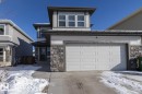 The property features a two-story design with a prominent front-facing garage - 26 Ellice Bend, Fort Saskatchewan, AB  - Outdoor 