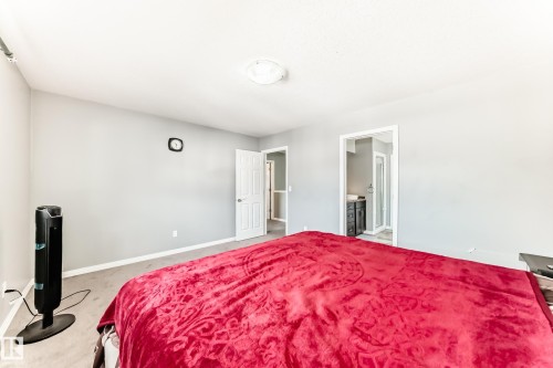 Bedroom featuring neutral-toned walls and carpeted flooring - 16720 61 Street, Edmonton, AB - Indoor Photo Showing Bedroom