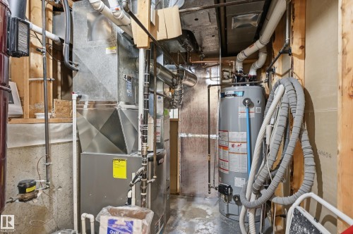 Utility room featuring a water heater and furnace unit - 85 Arlington Drive, St. Albert, AB - Indoor Photo Showing Basement