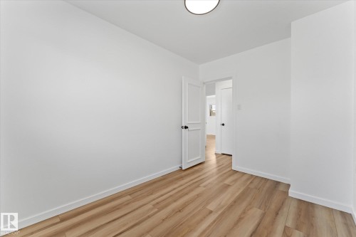Room featuring light wood-style flooring and white walls - 13116 128A Avenue, Edmonton, AB - Indoor Photo Showing Other Room