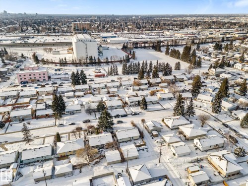 Aerial view of the neighbourhood, featuring residential properties with snow-covered roofs and mature trees - 13116 128A Avenue, Edmonton, AB - Outdoor With View