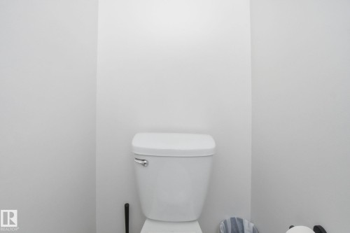 The bathroom features a white toilet - 29 9619 180 Street, Edmonton, AB - Indoor Photo Showing Bathroom