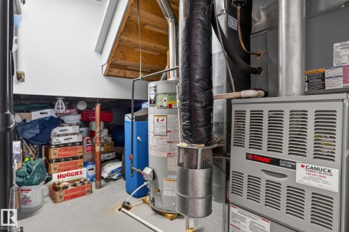 The property includes a water heater and a furnace - 22 Riverpointe, Fort Saskatchewan, AB - Indoor Photo Showing Basement