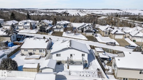The property features a private deck and a fenced yard with a storage shed - 22 Riverpointe, Fort Saskatchewan, AB - Outdoor