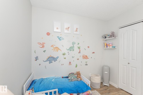 This room features light-colored walls and a textured ceiling - 8326 157 Avenue, Edmonton, AB - Indoor Photo Showing Bedroom