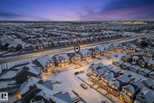Aerial view of the neighborhood featuring a dense arrangement of properties with snow-covered rooftops - 8225 24 Avenue, Edmonton, AB - Outdoor With View