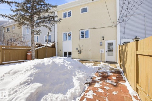 The property includes a paved patio area and a fenced yard - 6 Garden Crescent, St. Albert, AB - Outdoor