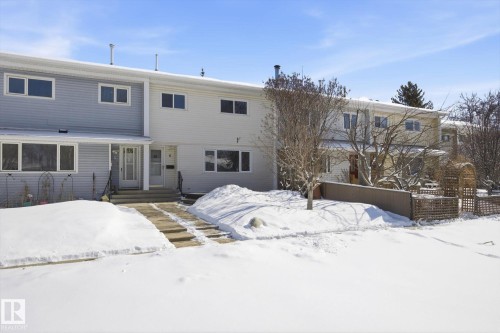 The property features a multi-level structure with light-colored siding - 6 Garden Crescent, St. Albert, AB - Outdoor