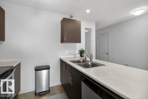 315 142 Ebbers Boulevard, Edmonton, AB - Indoor Photo Showing Kitchen With Double Sink