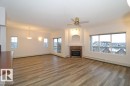 414 5280 Terwillegar Boulevard, Edmonton, AB  - Indoor Photo Showing Living Room With Fireplace 