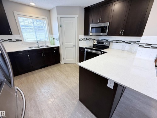 41 50 Mclaughlin Drive, Spruce Grove, AB - Indoor Photo Showing Kitchen With Double Sink