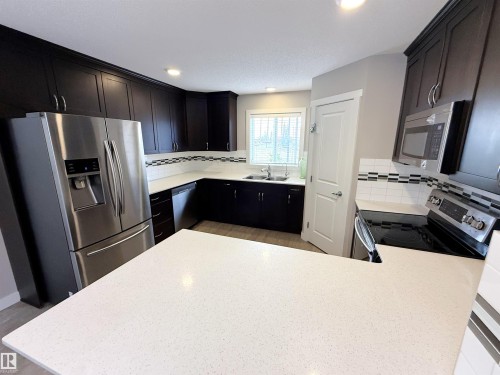 41 50 Mclaughlin Drive, Spruce Grove, AB - Indoor Photo Showing Kitchen With Double Sink