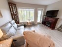 41 50 Mclaughlin Drive, Spruce Grove, AB  - Indoor Photo Showing Living Room With Fireplace 