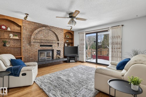 4720 147A Street, Edmonton, AB - Indoor Photo Showing Living Room With Fireplace