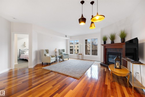 305 9803 96A Street, Edmonton, AB - Indoor Photo Showing Living Room With Fireplace