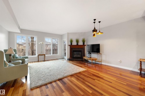 305 9803 96A Street, Edmonton, AB - Indoor Photo Showing Living Room With Fireplace