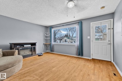 4717 49 Avenue, Legal, AB - Indoor Photo Showing Other Room With Fireplace