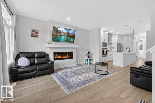 1120 Plum Ln, Edmonton, AB - Indoor Photo Showing Living Room With Fireplace