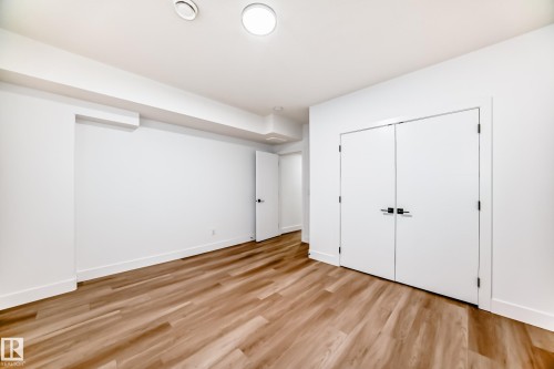 Spacious room featuring light wood flooring, white walls, and recessed lighting - 15108 11 Street, Edmonton, AB - Indoor Photo Showing Other Room