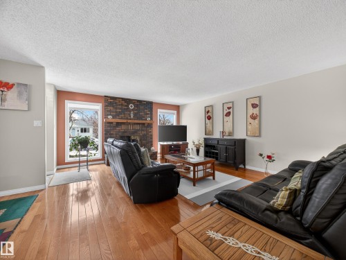 8906 83 Avenue, Edmonton, AB - Indoor Photo Showing Living Room With Fireplace