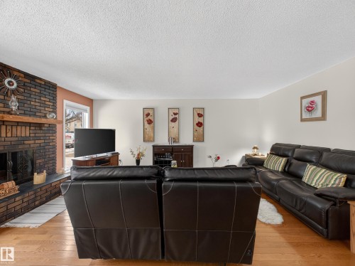 8906 83 Avenue, Edmonton, AB - Indoor Photo Showing Living Room With Fireplace