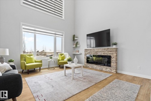 82 Meadowland Way, Spruce Grove, AB - Indoor Photo Showing Living Room With Fireplace