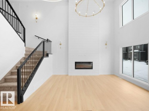 3324 Chickadee Dr, Edmonton, AB - Indoor Photo Showing Other Room With Fireplace