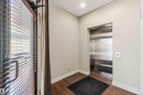 Entryway featuring direct elevator access, hardwood flooring, and a large window - 401 10009 102 Avenue, Edmonton, AB  - Indoor Photo Showing Other Room 