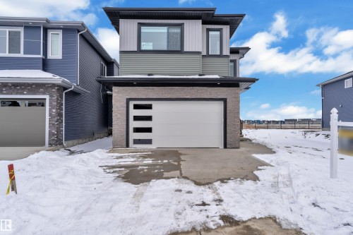 Contemporary exterior featuring grey siding and stone accents - 110 Eldridge Point(E), St. Albert, AB - Outdoor