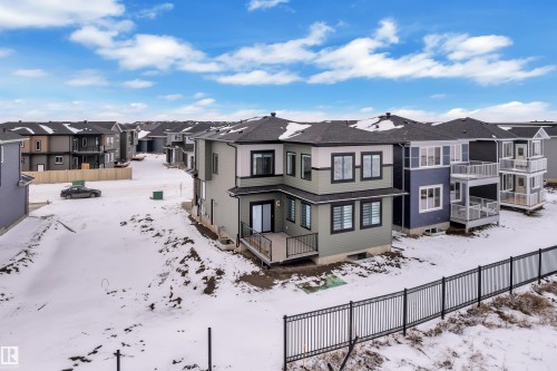 This property features a contemporary exterior with a dark grey roof and light grey and dark grey siding - 110 Eldridge Point(E), St. Albert, AB - Outdoor