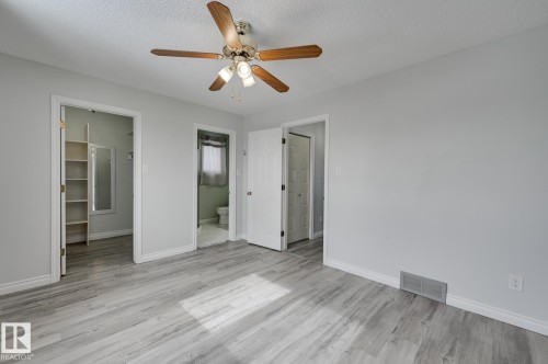 This room features light-colored walls and wood-style flooring - 8507 152B Avenue, Edmonton, AB - Indoor Photo Showing Other Room