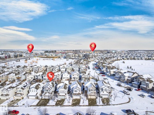 Aerial view of the neighborhood with residential properties featuring attached garages and driveways - 1121 59A Street, Edmonton, AB - Outdoor With View