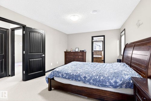 The property features light-colored walls and carpeted flooring - 1121 59A Street, Edmonton, AB - Indoor Photo Showing Bedroom