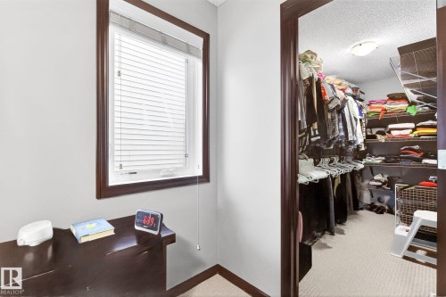 This area features a window with blinds and dark wood trim, providing natural light to the space - 1121 59A Street, Edmonton, AB - Indoor