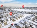 Aerial view of the community, showcasing residential properties with snow-covered roofs and streets - 1121 59A Street, Edmonton, AB  - Outdoor With View 