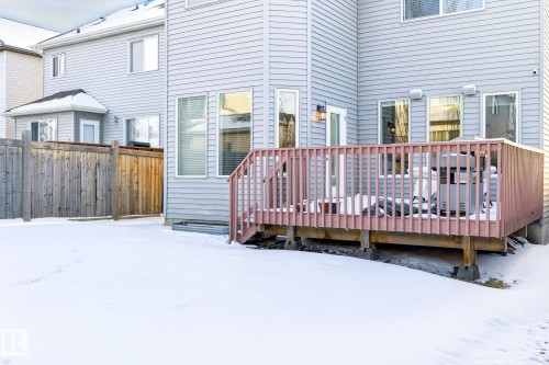 The property features a private fenced yard with a wooden deck - 1121 59A Street, Edmonton, AB - Outdoor With Deck Patio Veranda With Exterior
